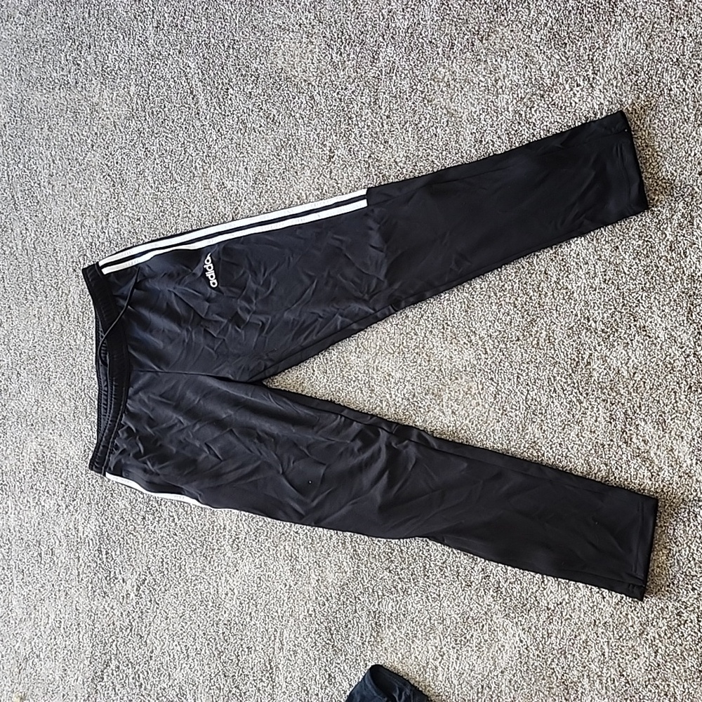 Black Adidas 100% polyester workout pants size medium.